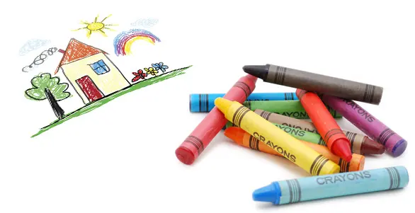 Colorful crayons and child's drawing