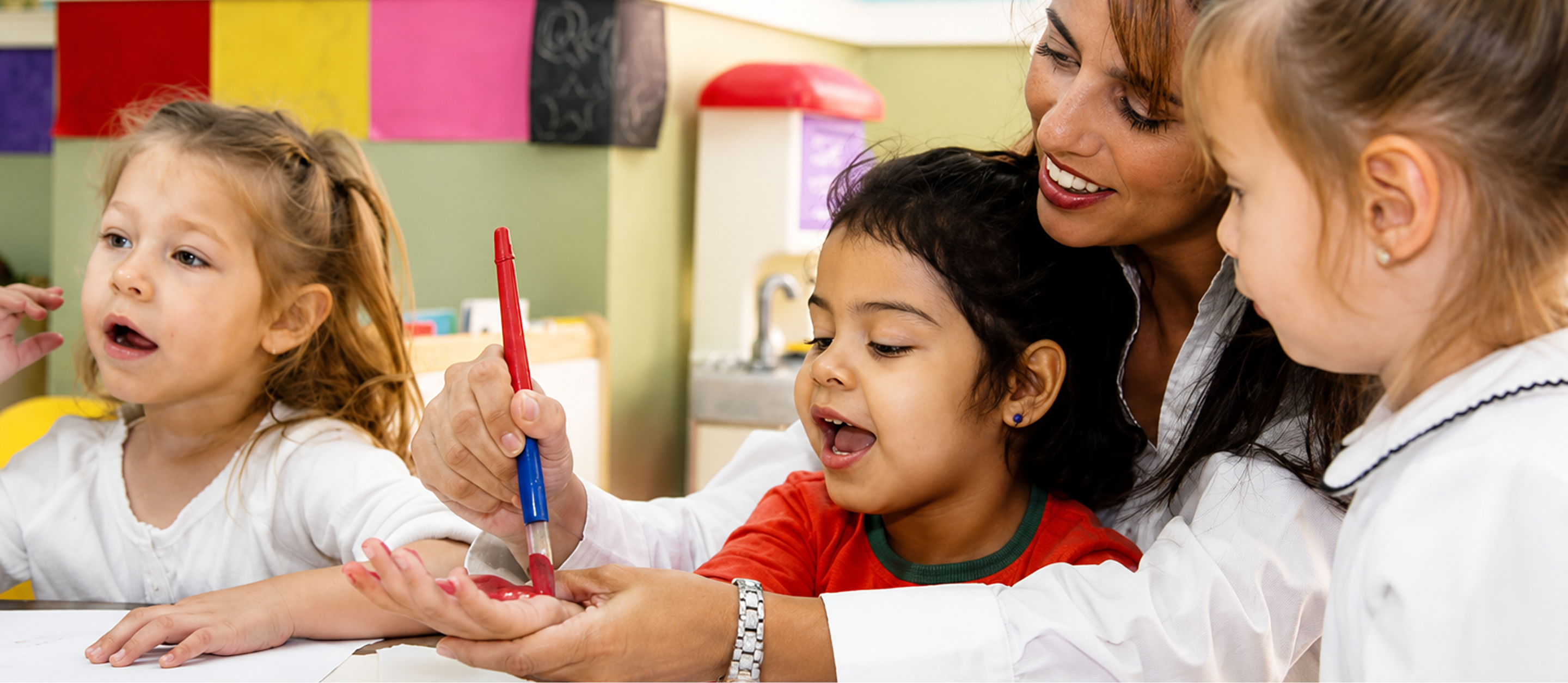 Kids enjoying art class with teacher