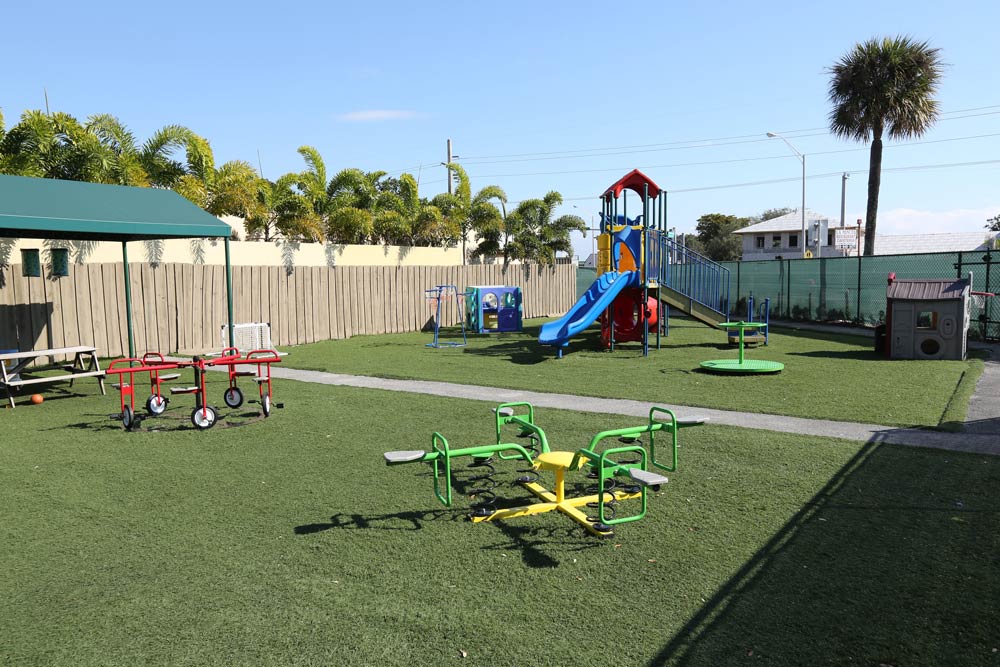 A playground with swings, slides and other equipment.