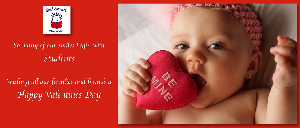 A baby holding a heart shaped pillow with the words " be mine ".